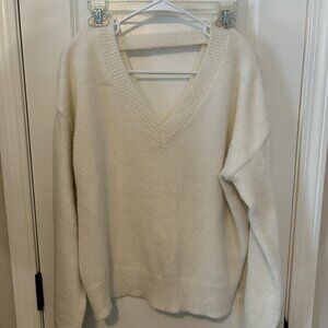Cream fuzzy sweater, open back and v neck